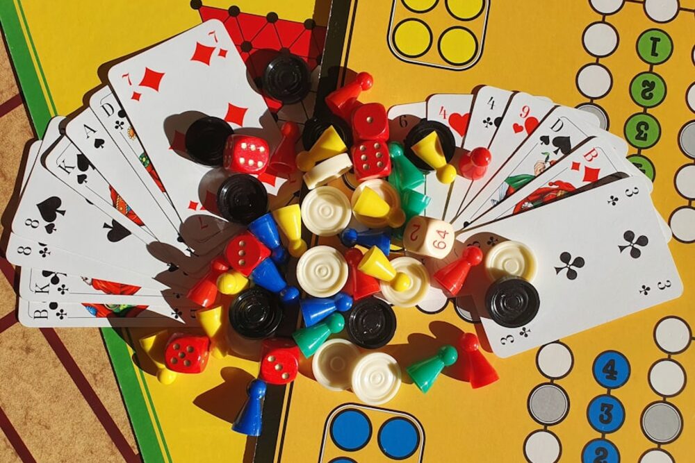A colourful board game laid out with cards and playing pieces