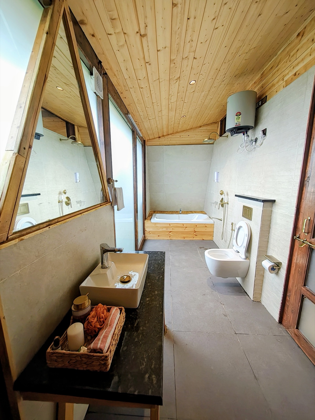 Spacious en-suite bathroom with a sunken bathtub and vanity