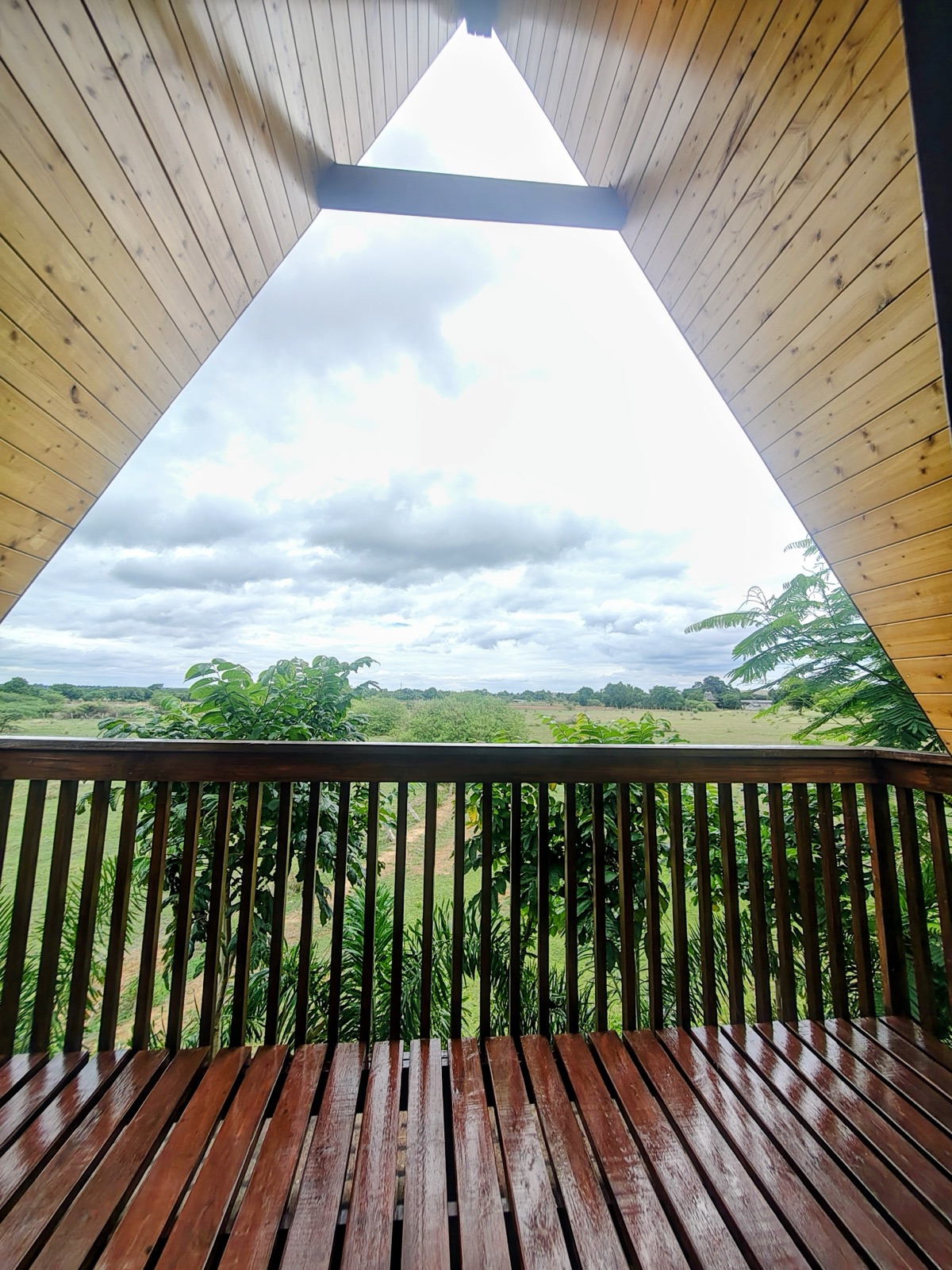 Open countryside view framed by the triangular A-frame deck